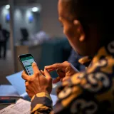 User checking withdrawal status on OPay mobile app with BetExplorer interface in Nigerian setting